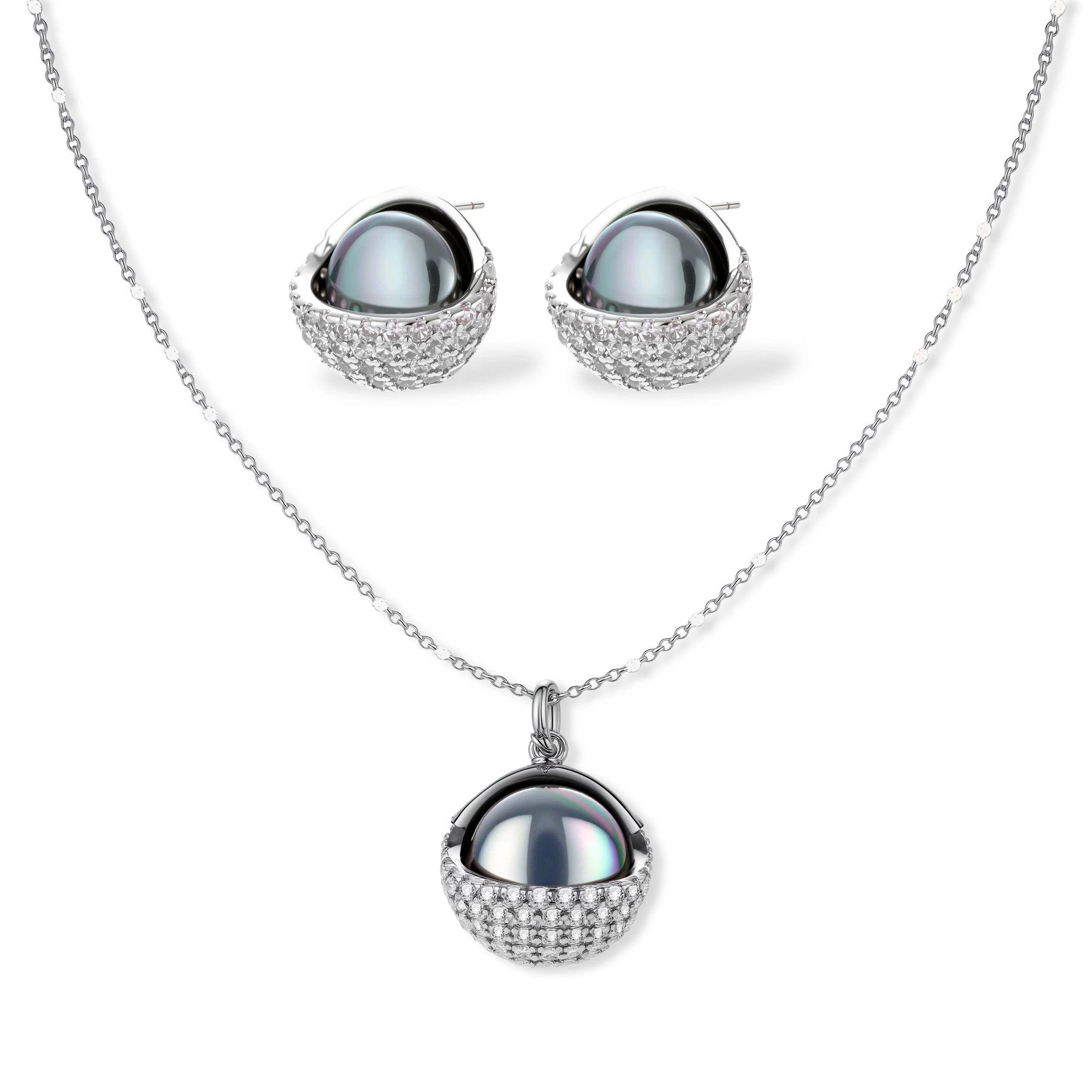 Elegant spherical pendant necklace and earrings set featuring crystal-pavé bottom half in gold or silver finish on white background.