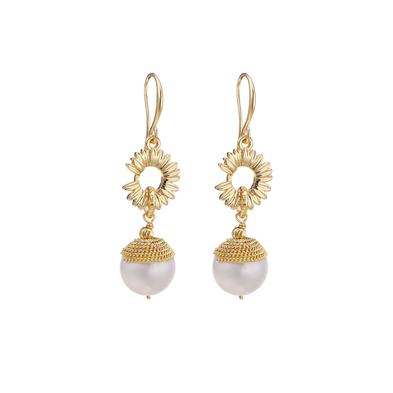 Gold sunburst charm earrings with baroque pearl drops on French hooks against cream background