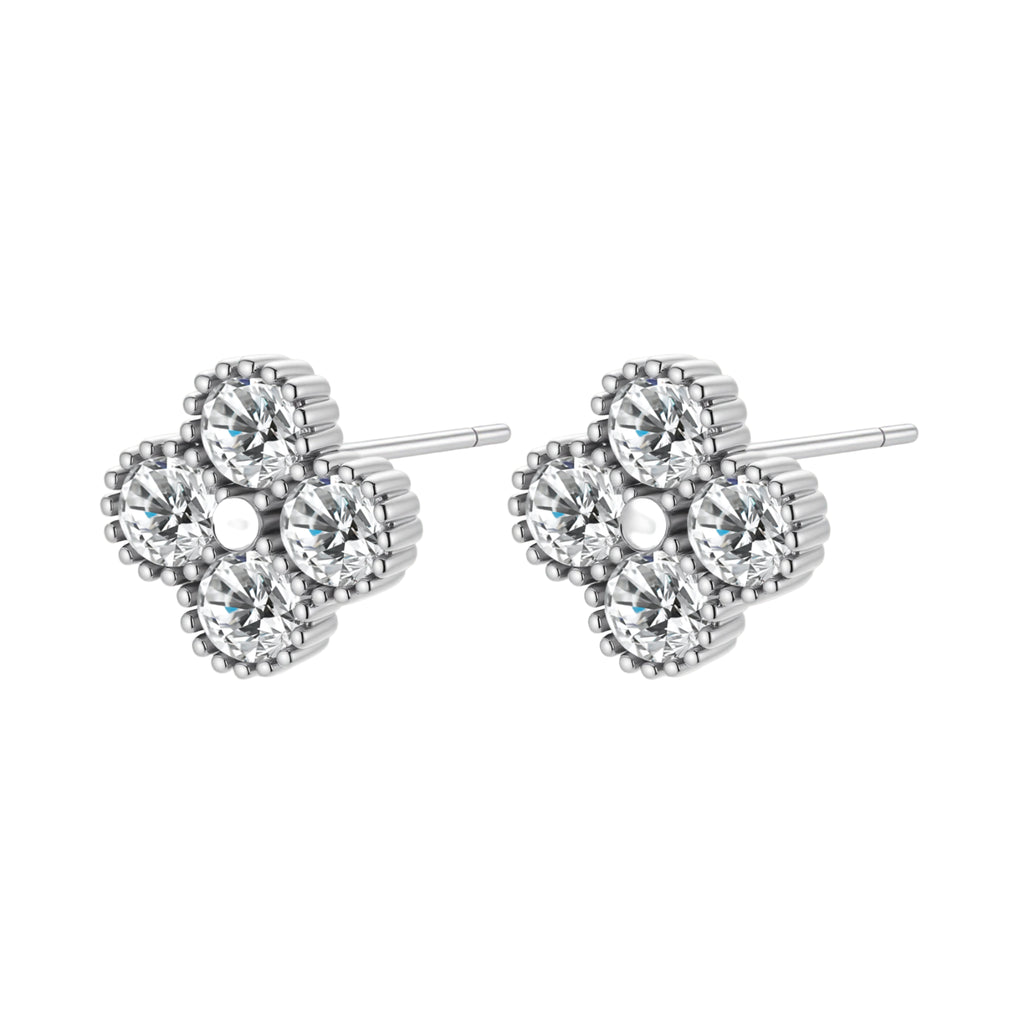 Dainty sterling silver quatrefoil stud earrings with four brilliant moissanite stones and center accent on white background.