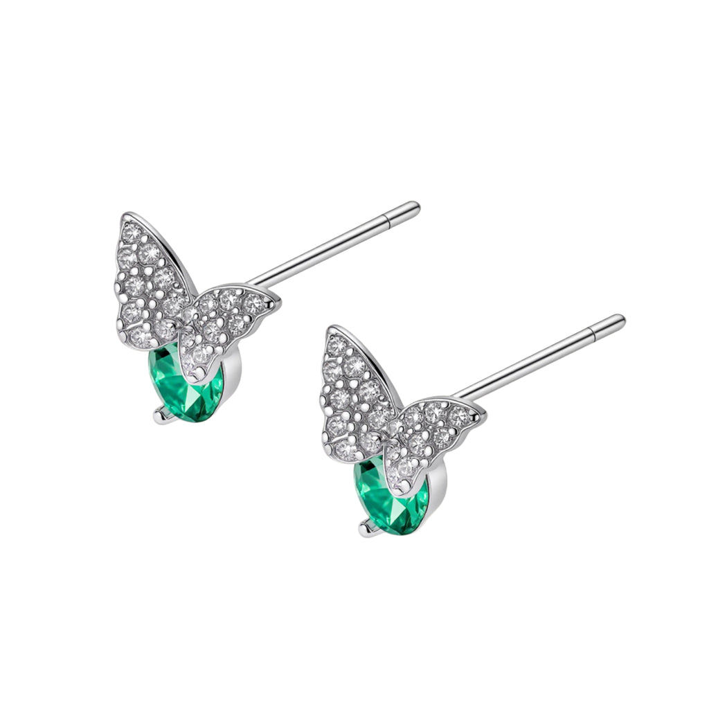 Sterling silver butterfly stud earrings with crystal wings and mint green center stones on cream background.