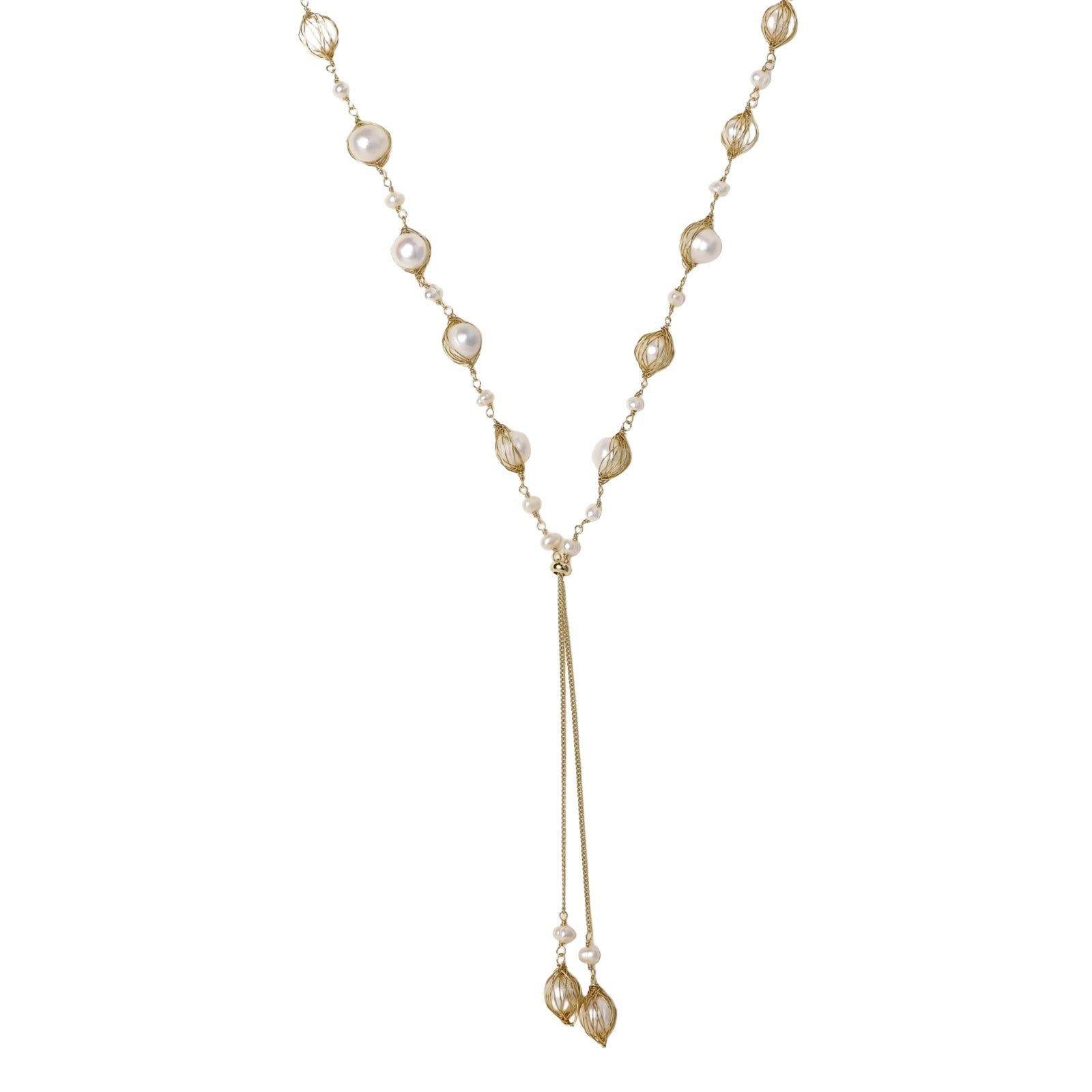 Adjustable gold lariat necklace with freshwater pearls nested in delicate cage settings and Y-shaped tassel drop