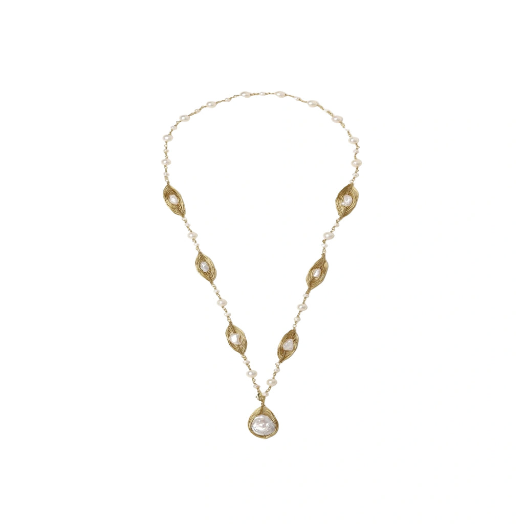 14K gold plated necklace with organic leaf motifs and freshwater pearls arranged in an elegant chain design on neutral background.