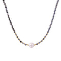 Dainty necklace with faceted purple iolite beads, gold vermeil accents, and central pink-white freshwater pearl.