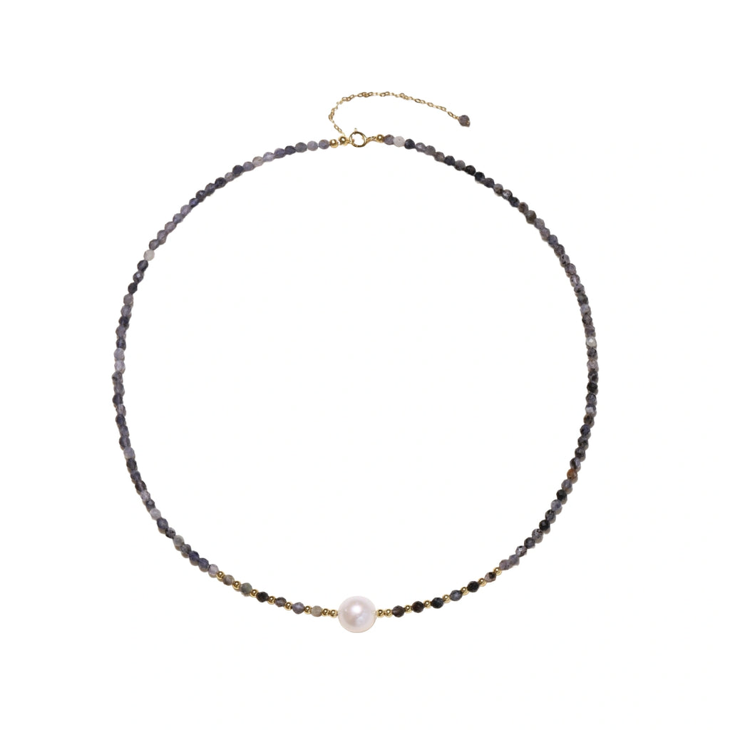 Dainty necklace with faceted purple iolite beads, gold vermeil accents, and central pink-white freshwater pearl.