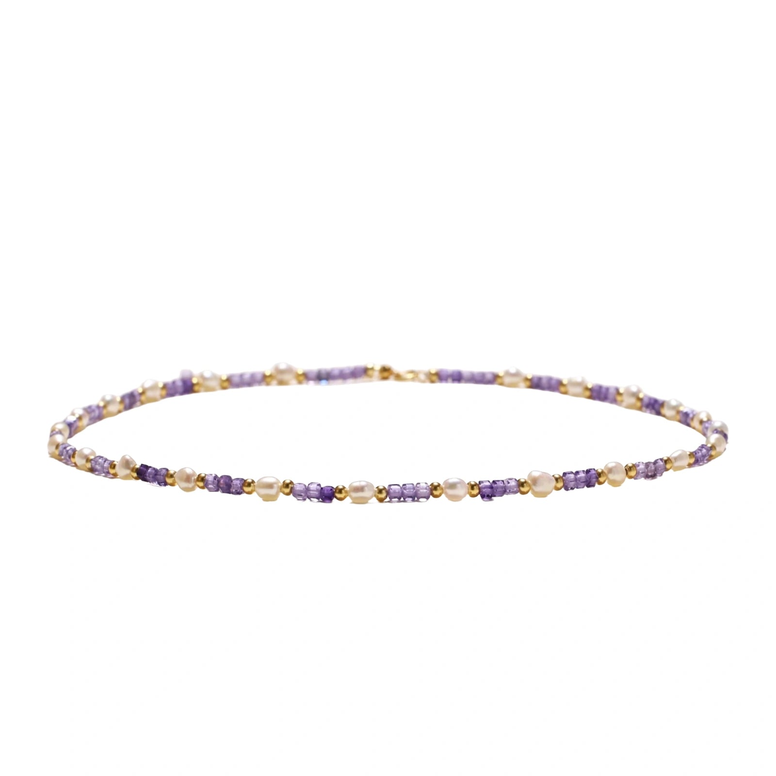 Delicate 18K gold vermeil necklace with alternating lavender zirconia beads and white freshwater pearls on cream background