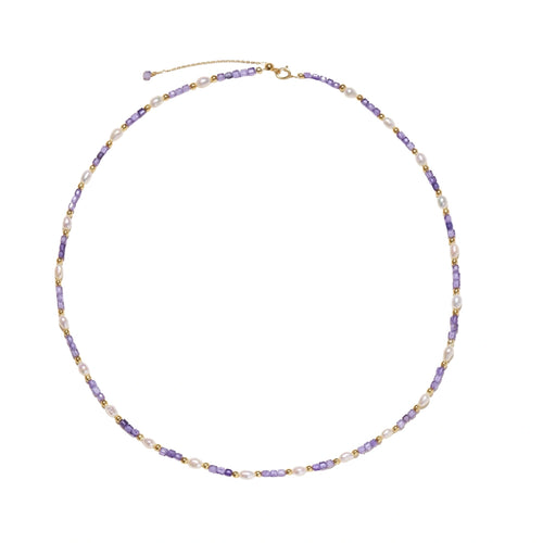 Delicate 18K gold vermeil necklace with alternating lavender zirconia beads and white freshwater pearls on cream background