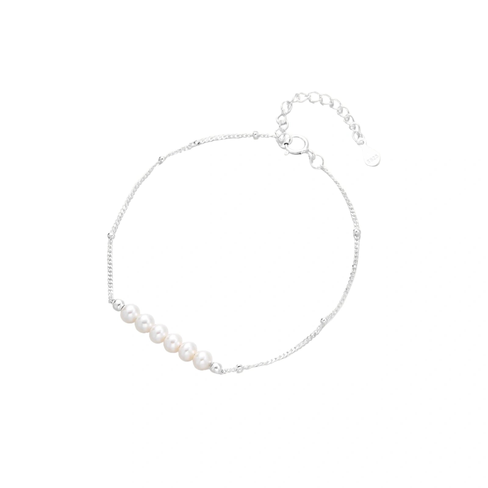 Delicate rhodium-plated silver chain bracelet with row of small baroque pearls centered on white background.