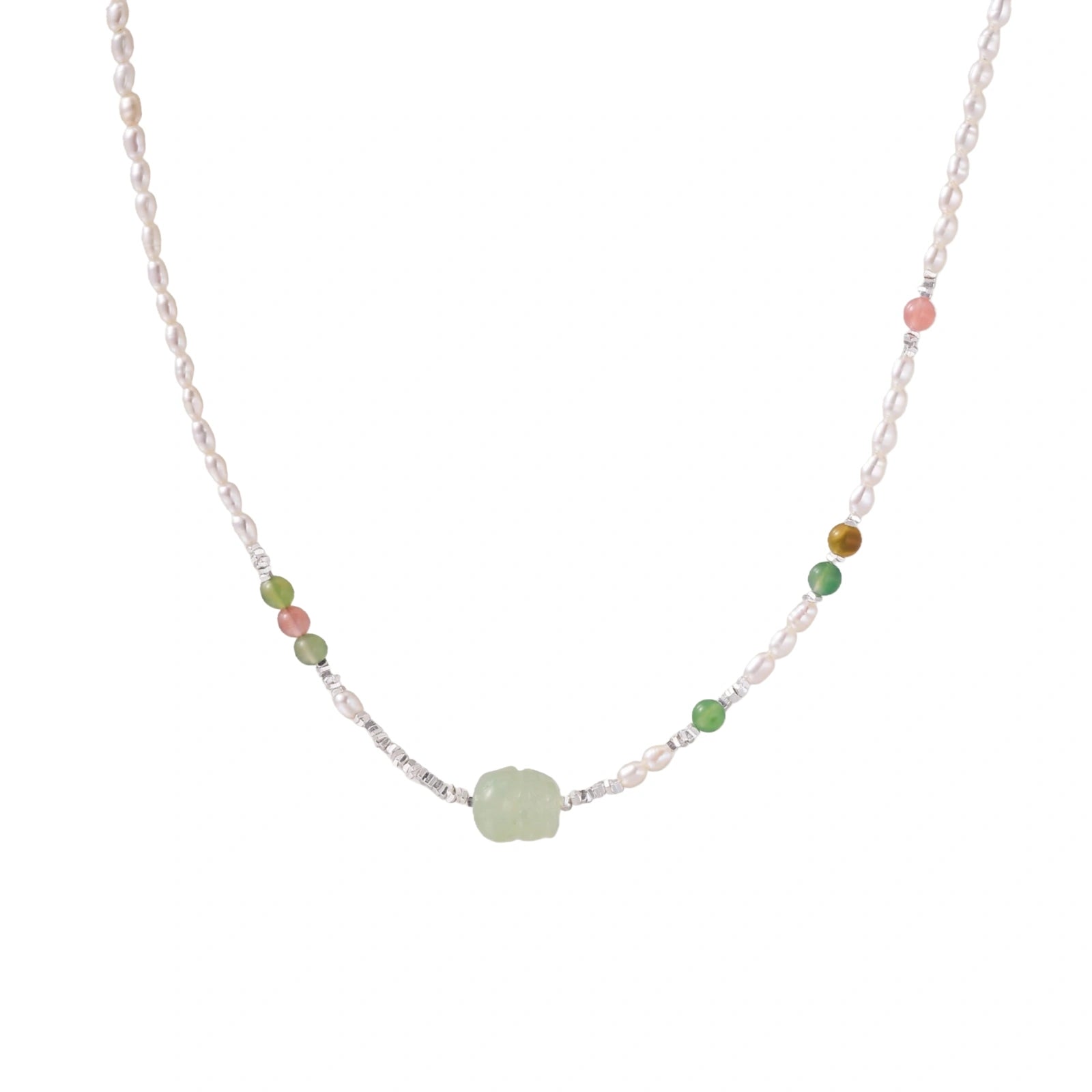 Delicate pearl necklace with pale green serpentine jade centerpiece and colorful agate beads on cream background