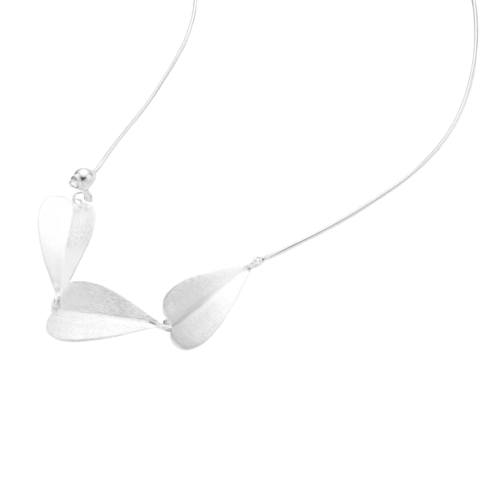 Minimalist sterling silver necklace with three brushed leaf-shaped pendants on delicate chain against white background
