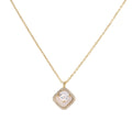 Gold quatrefoil pendant with crystal center on iridescent mother-of-pearl base, adjustable gold chain on cream background