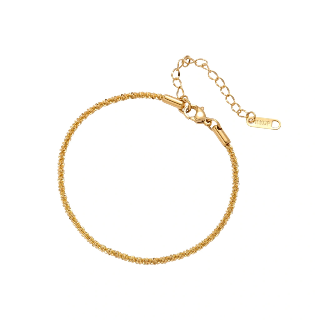 Delicate 18K gold-plated stainless steel bracelet with textured beaded chain on cream background