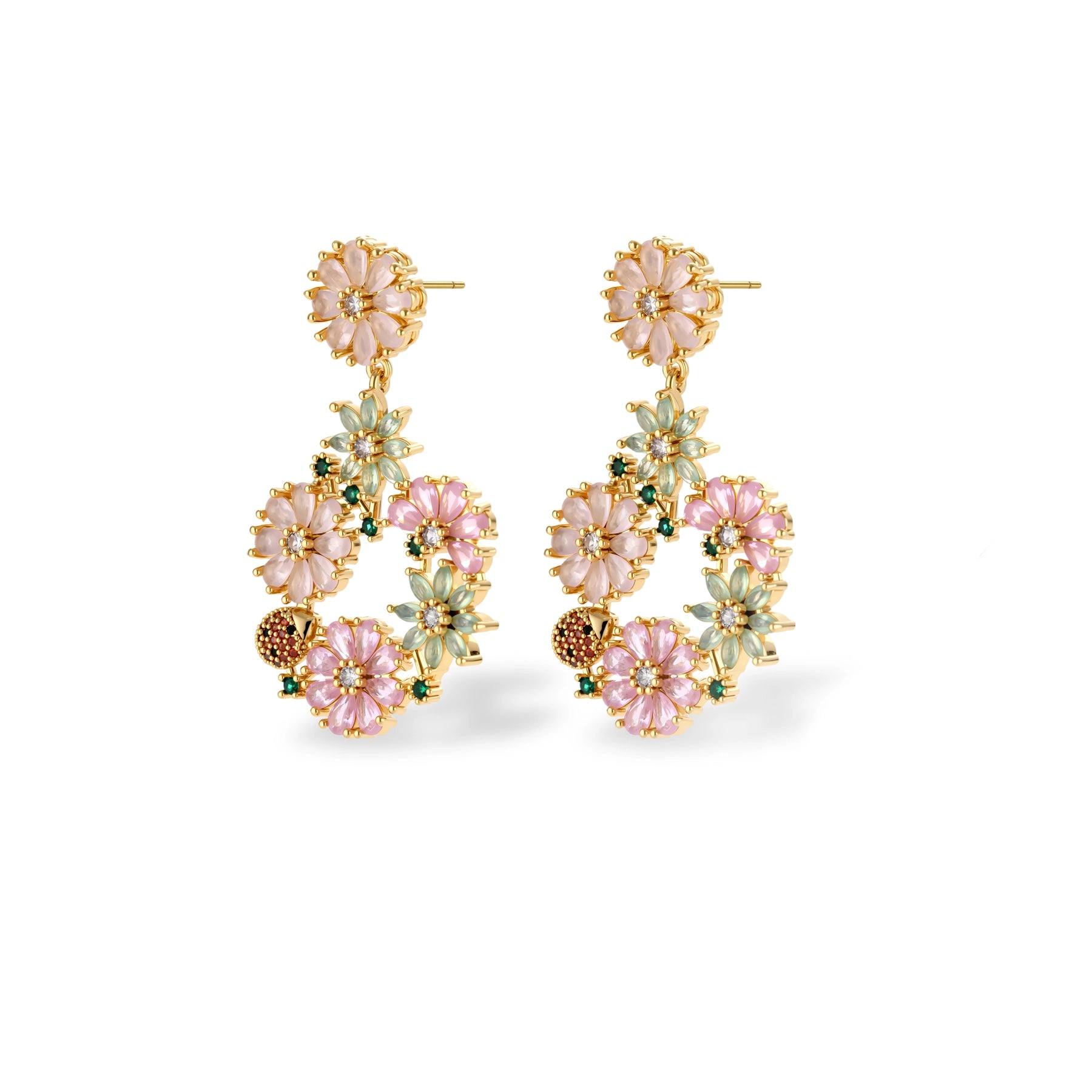 14K gold plated jewelry set with pink and green cubic zirconia flowers arranged in wreath design on cream background